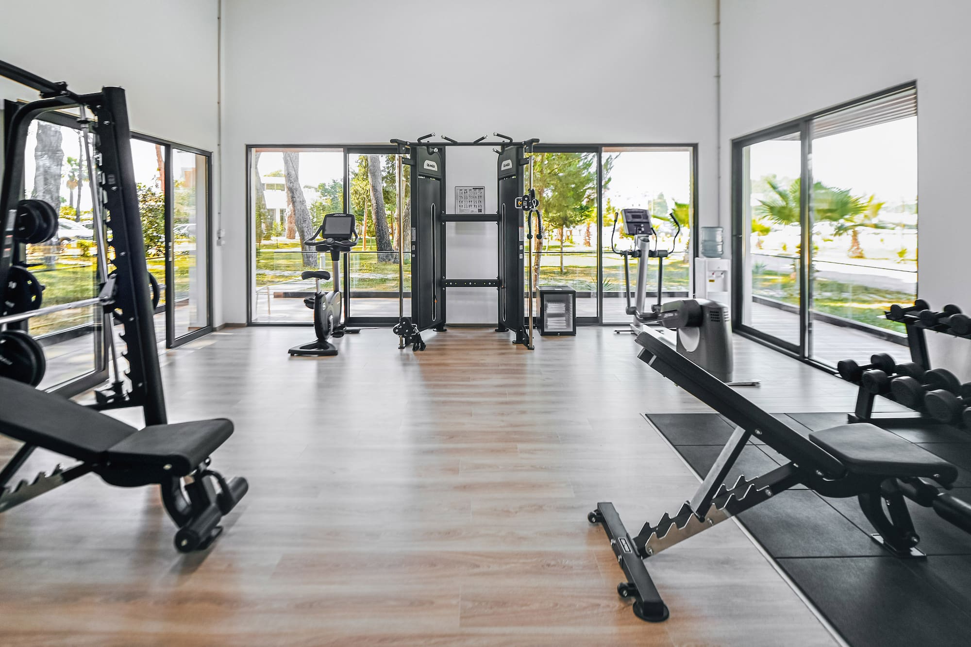 a room with exercise equipment and exercise bikes