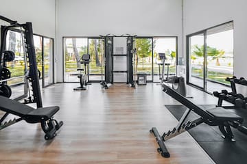 a room with exercise equipment and exercise bikes