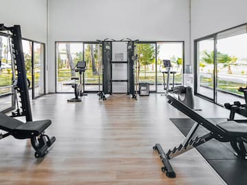 a room with exercise equipment and exercise bikes