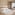 a room with two beds and a hat on the side
