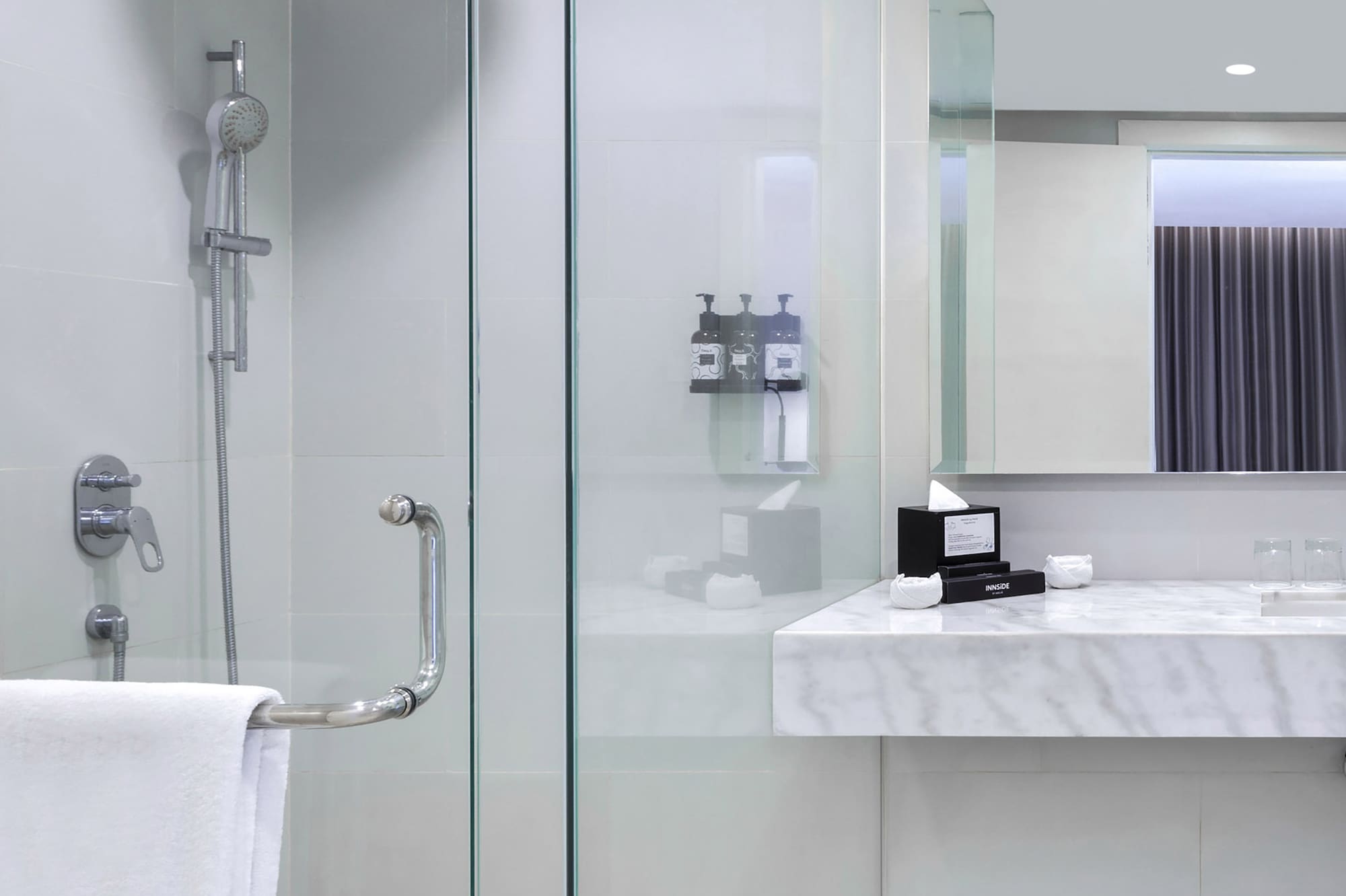 a bathroom with a shower and sink