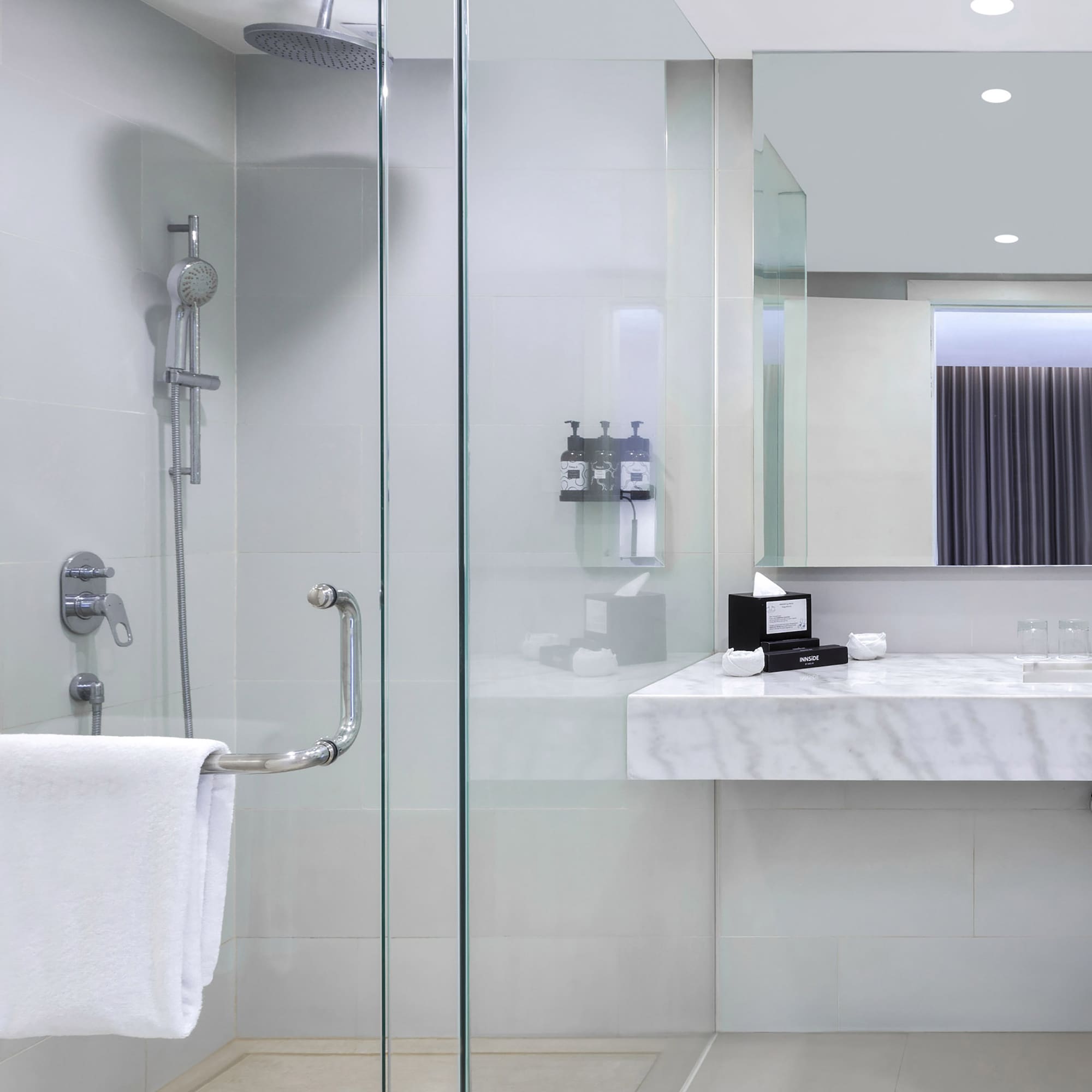 a bathroom with a shower and sink