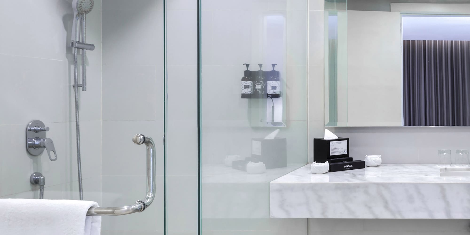 a bathroom with a shower and sink