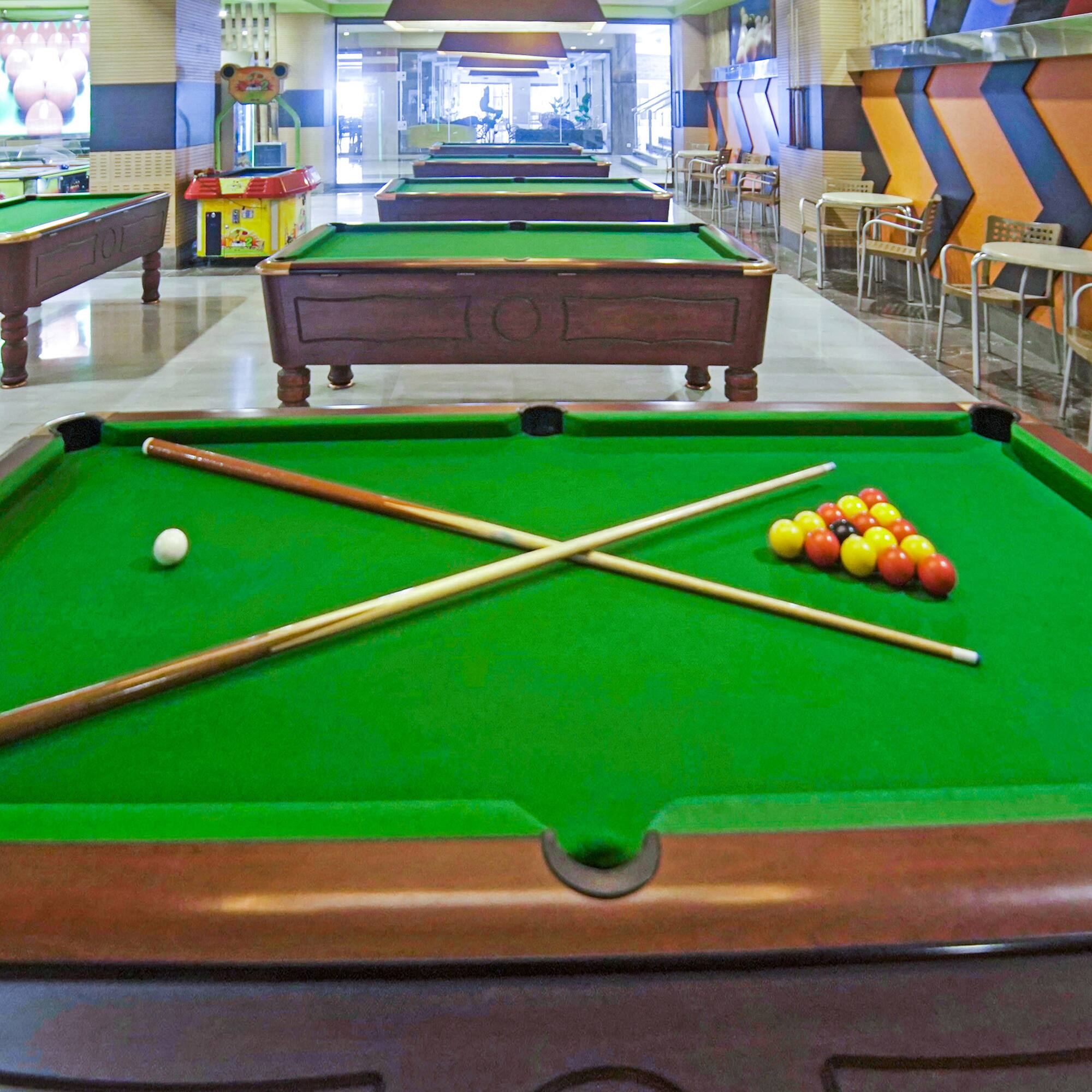 pool tables with balls and sticks on it