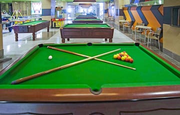 pool tables with balls and sticks on it