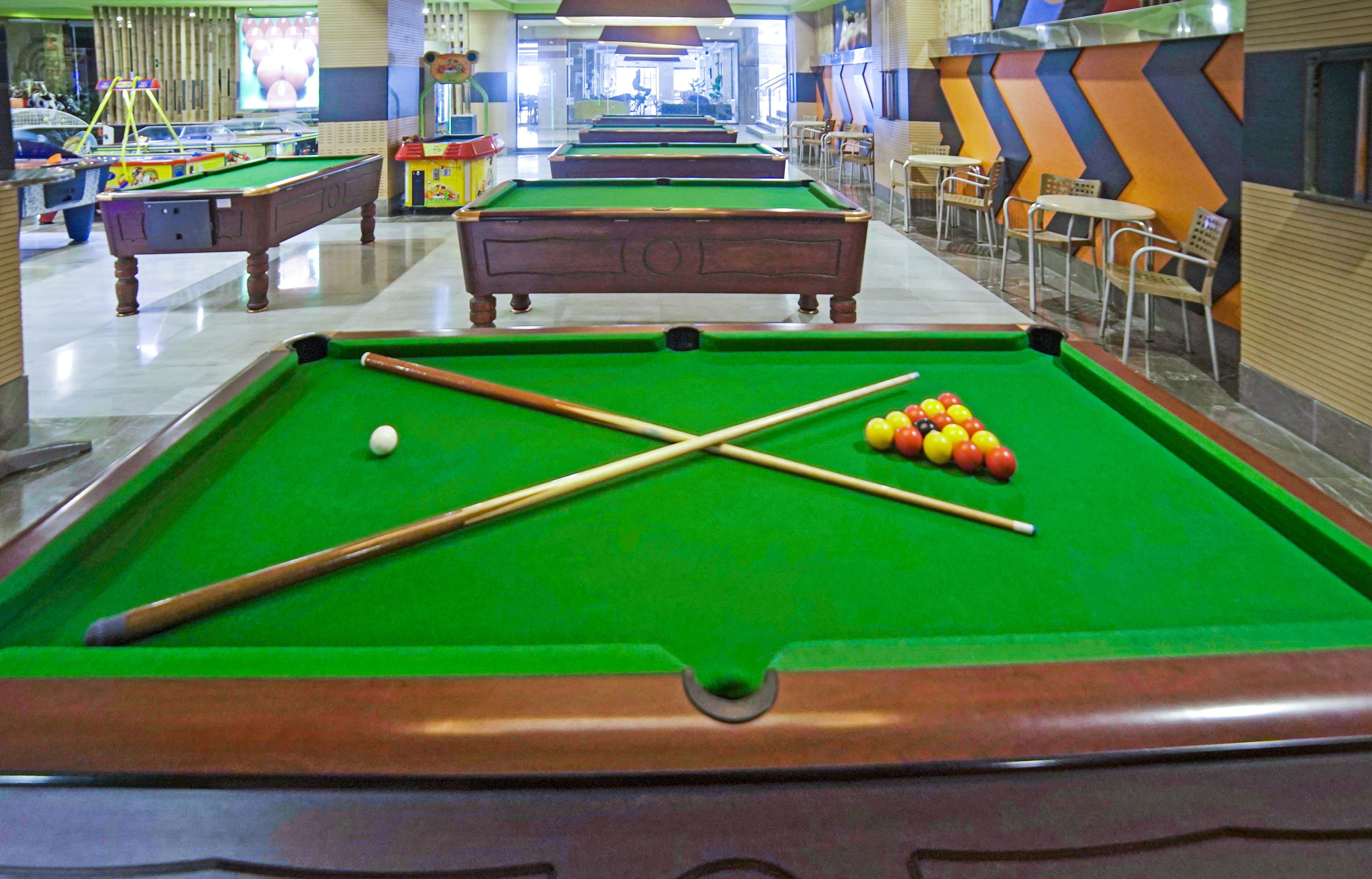 pool tables with balls and sticks on it
