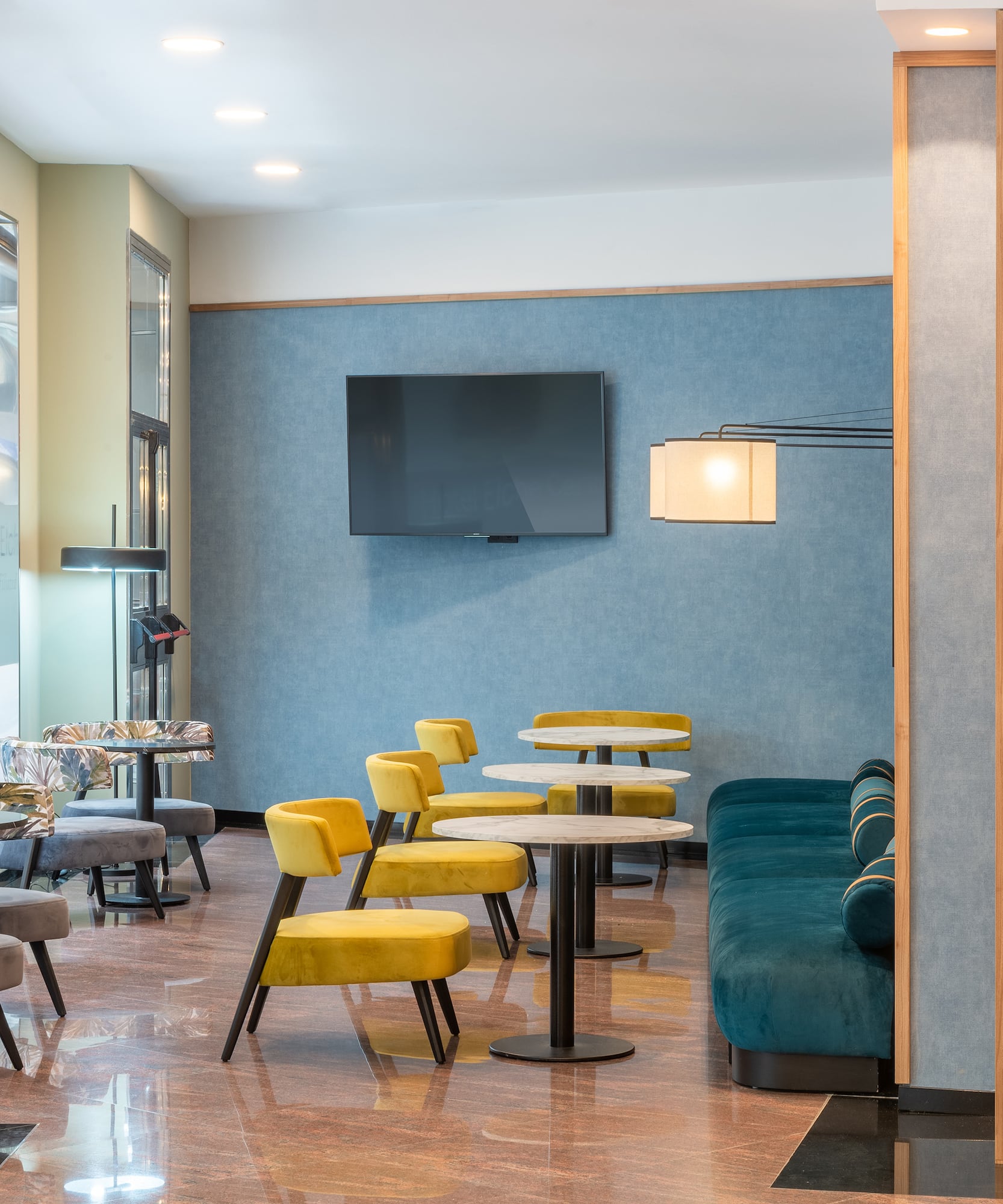 a room with a tv and tables