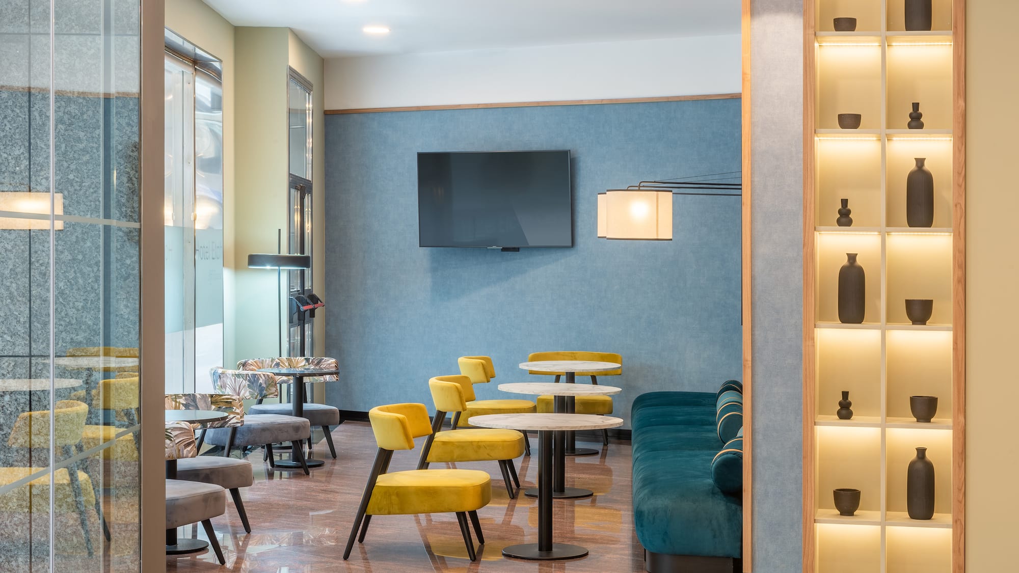 a room with a tv and tables