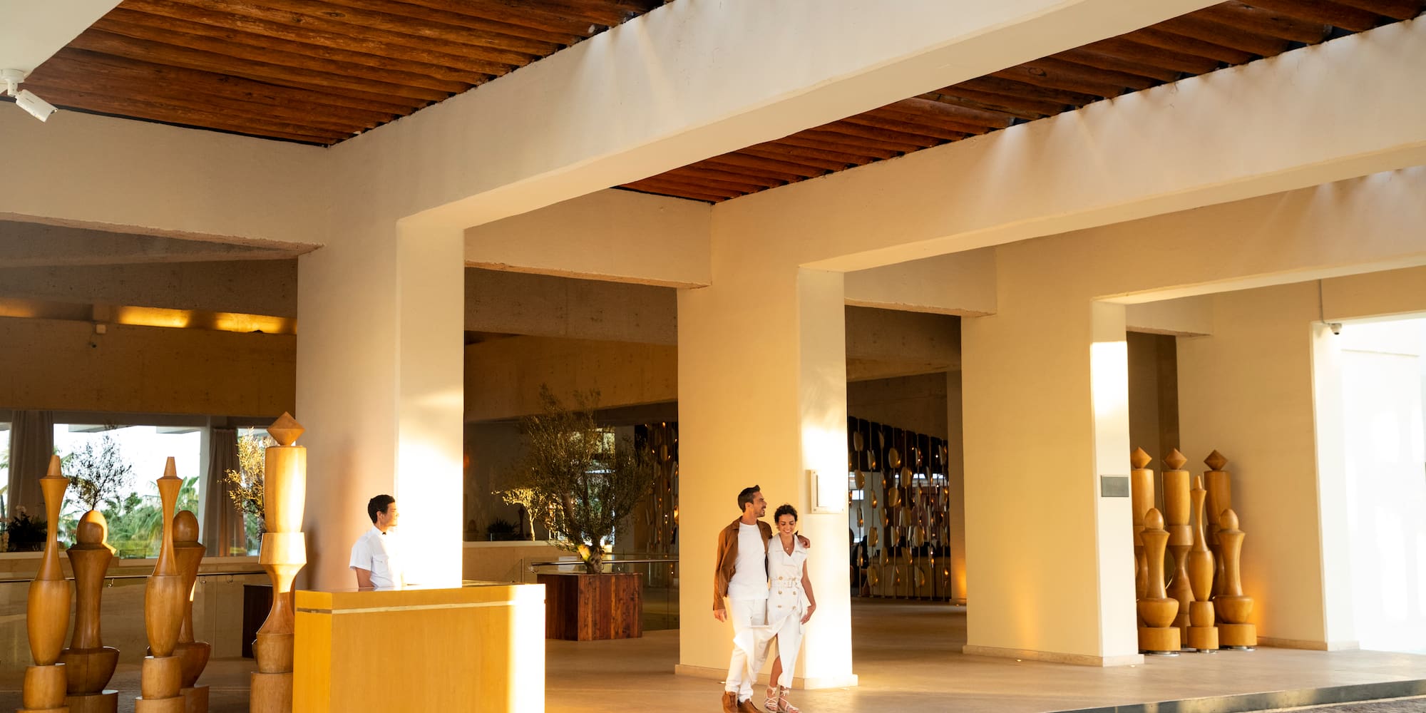 a group of people standing in a lobby