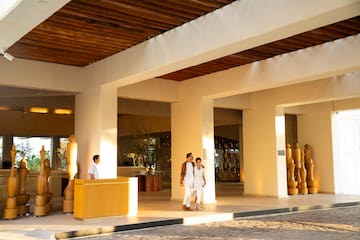a group of people standing in a lobby
