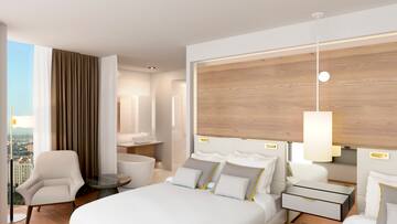 a bedroom with a bed and a tub