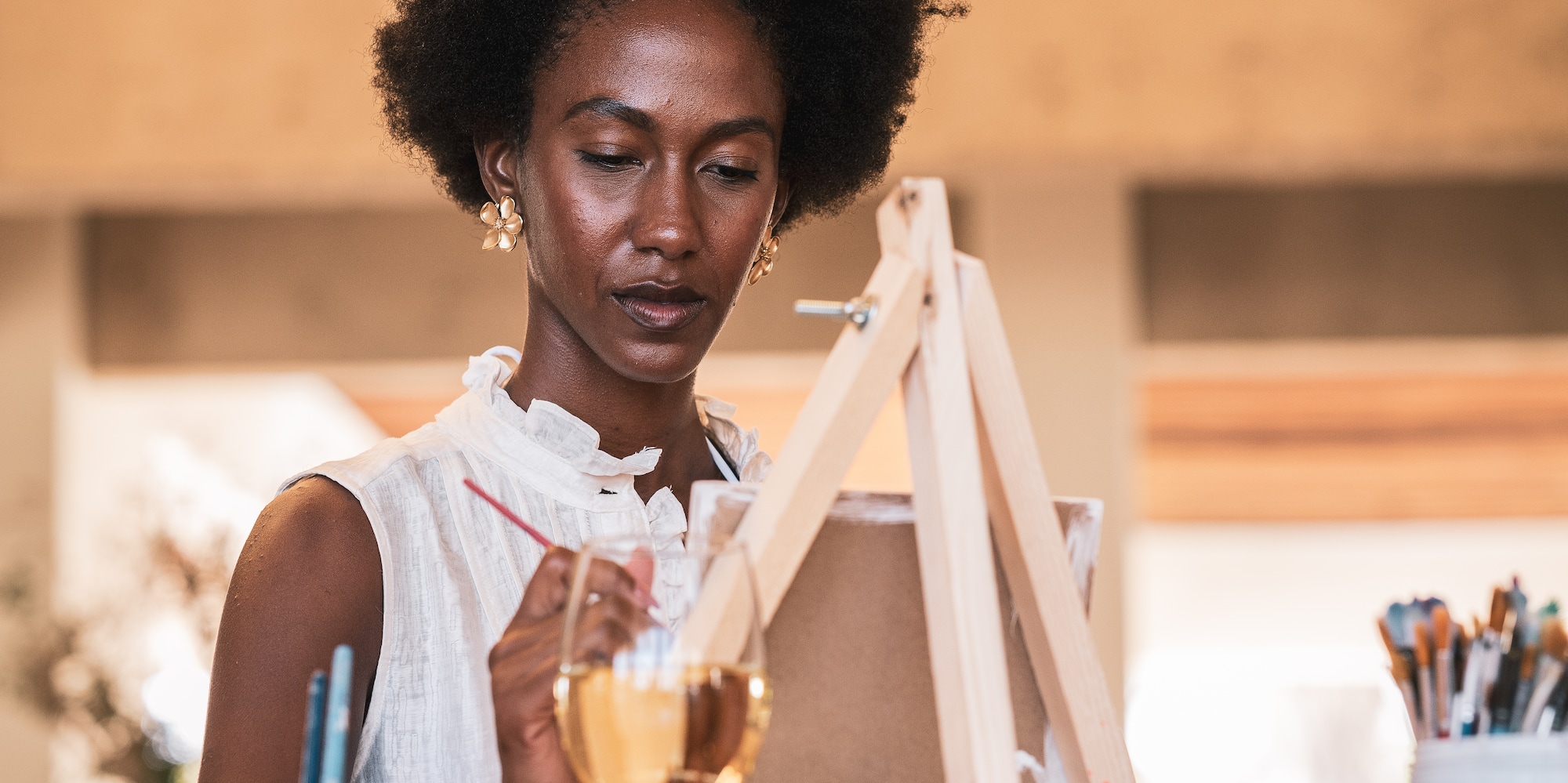 woman painting in canvas
