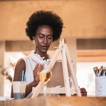 woman painting in canvas
