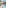 Tropical resort pool deck with modern hotel, palm trees, and outdoor lounge.