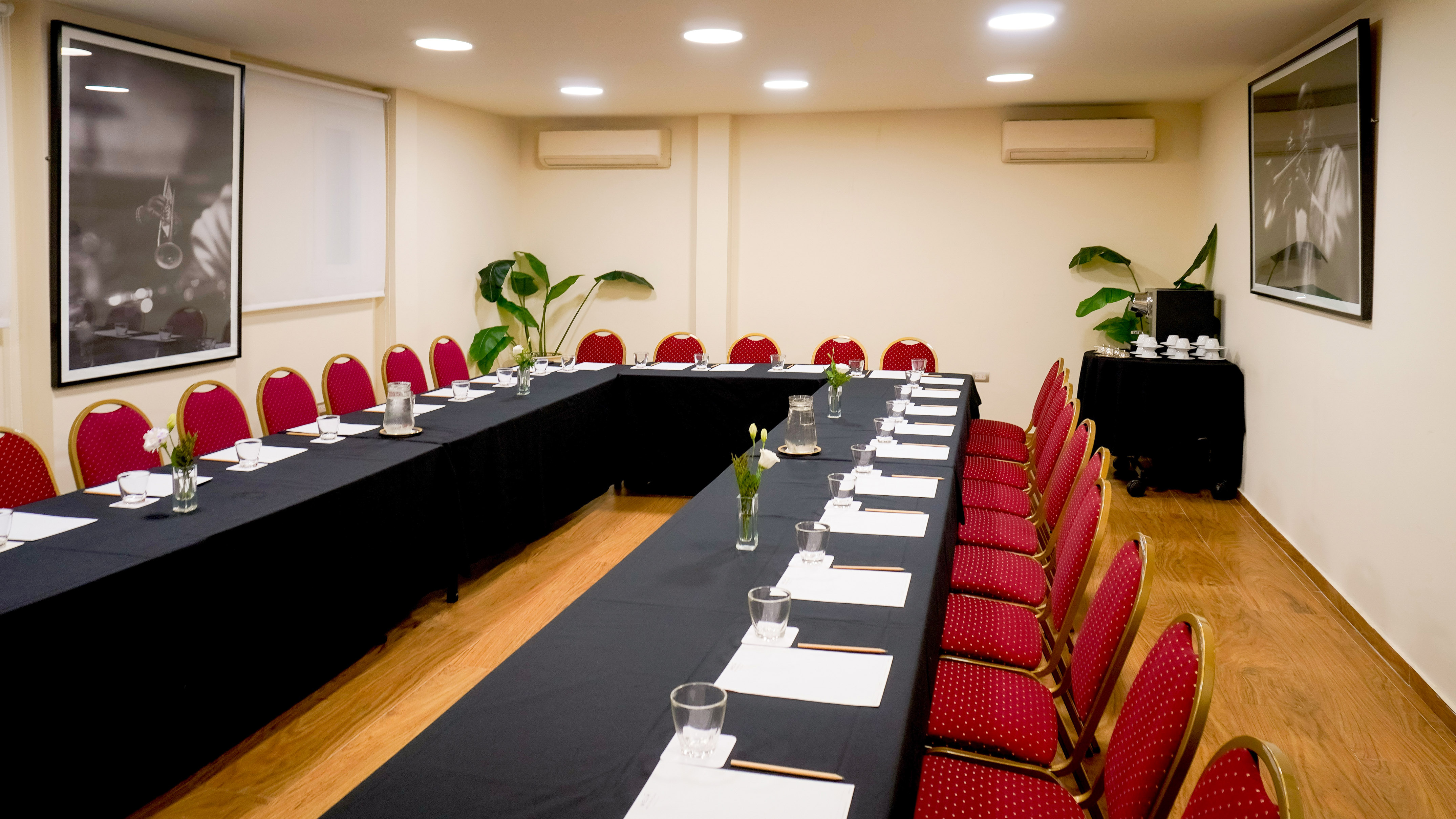 a room with long tables and chairs