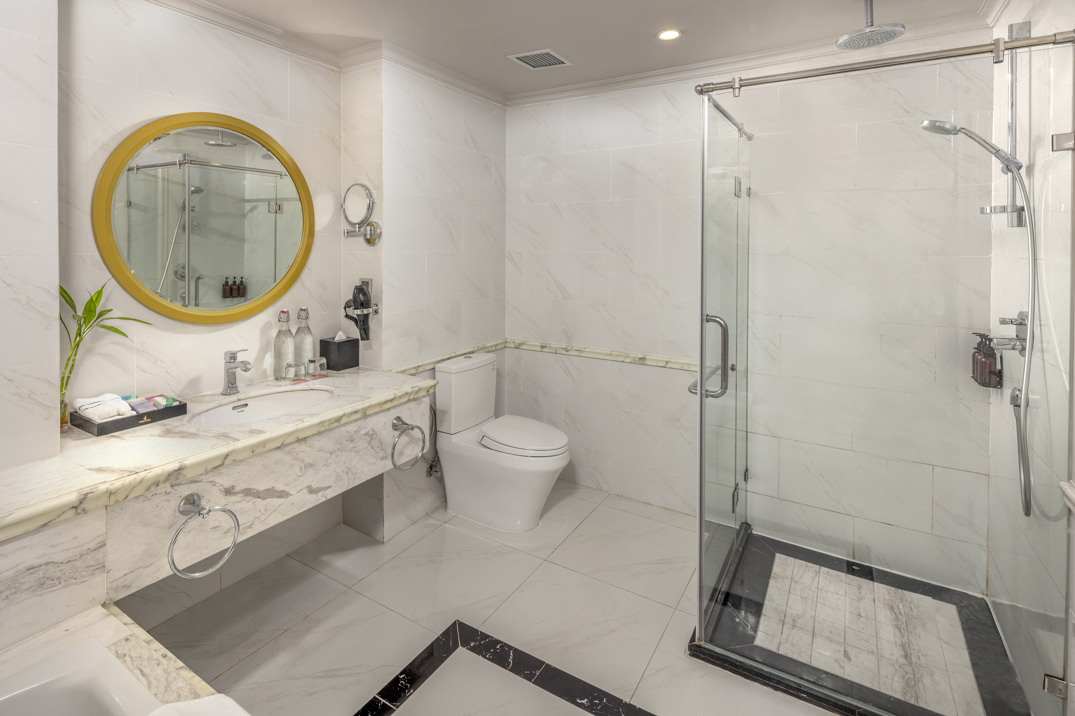 a bathroom with a shower and sink