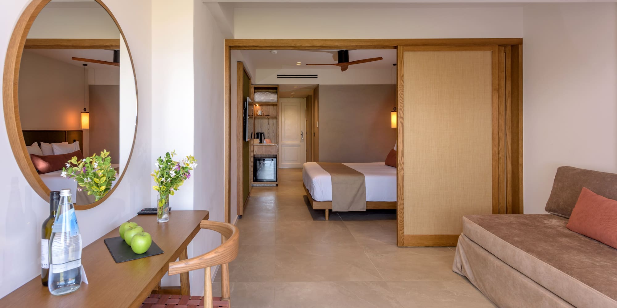 a room with a bed and a mirror