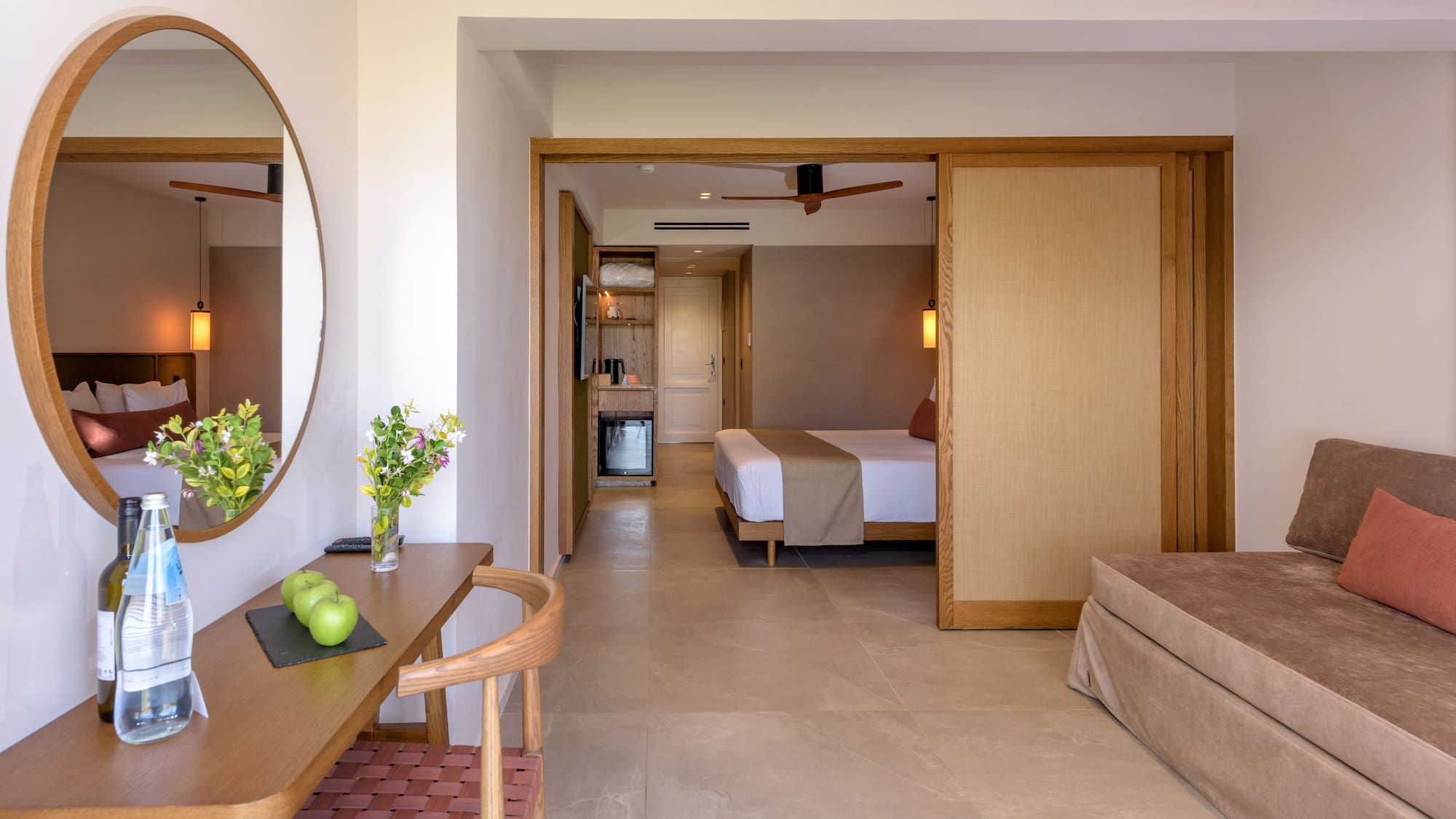 a room with a bed and a mirror