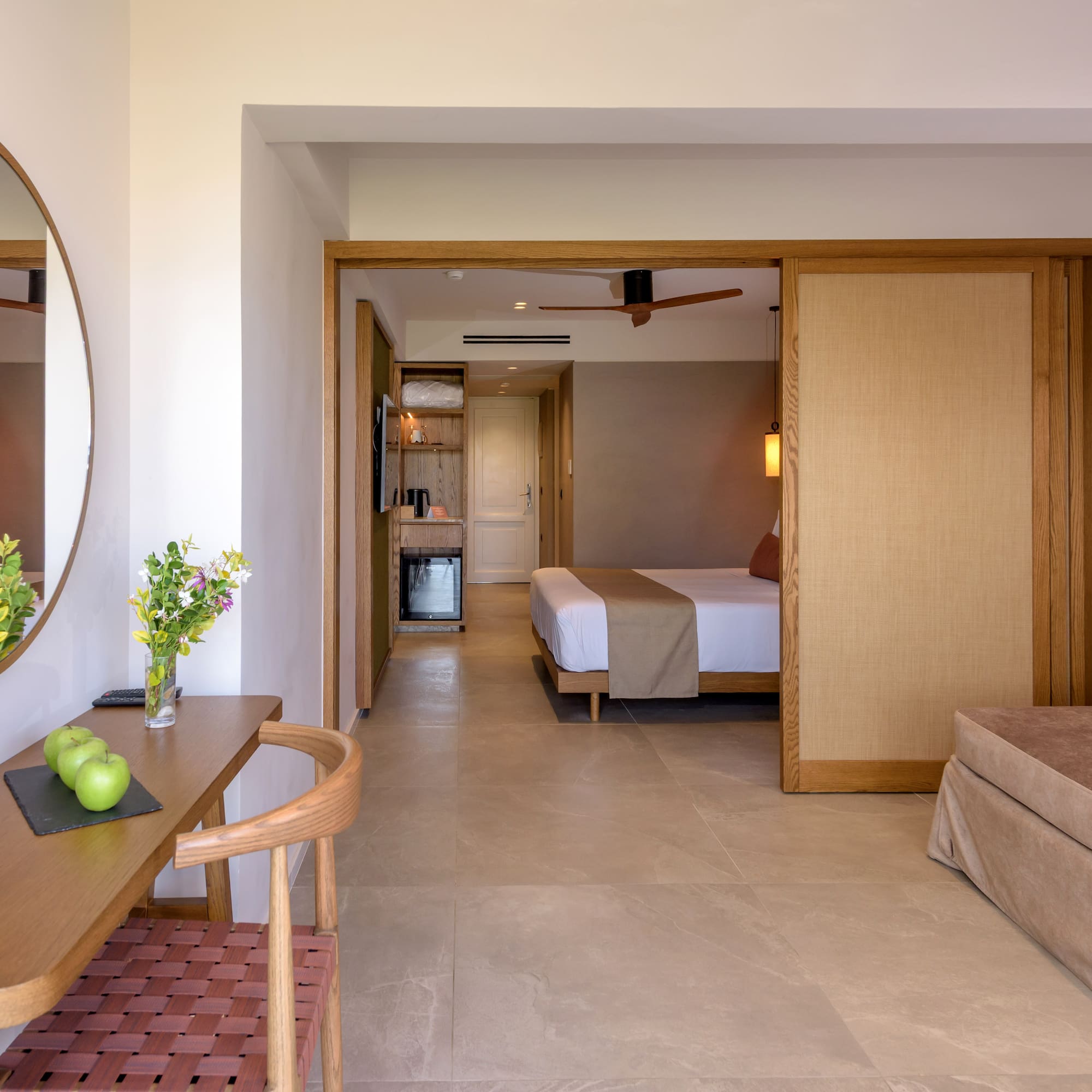 a room with a bed and a mirror