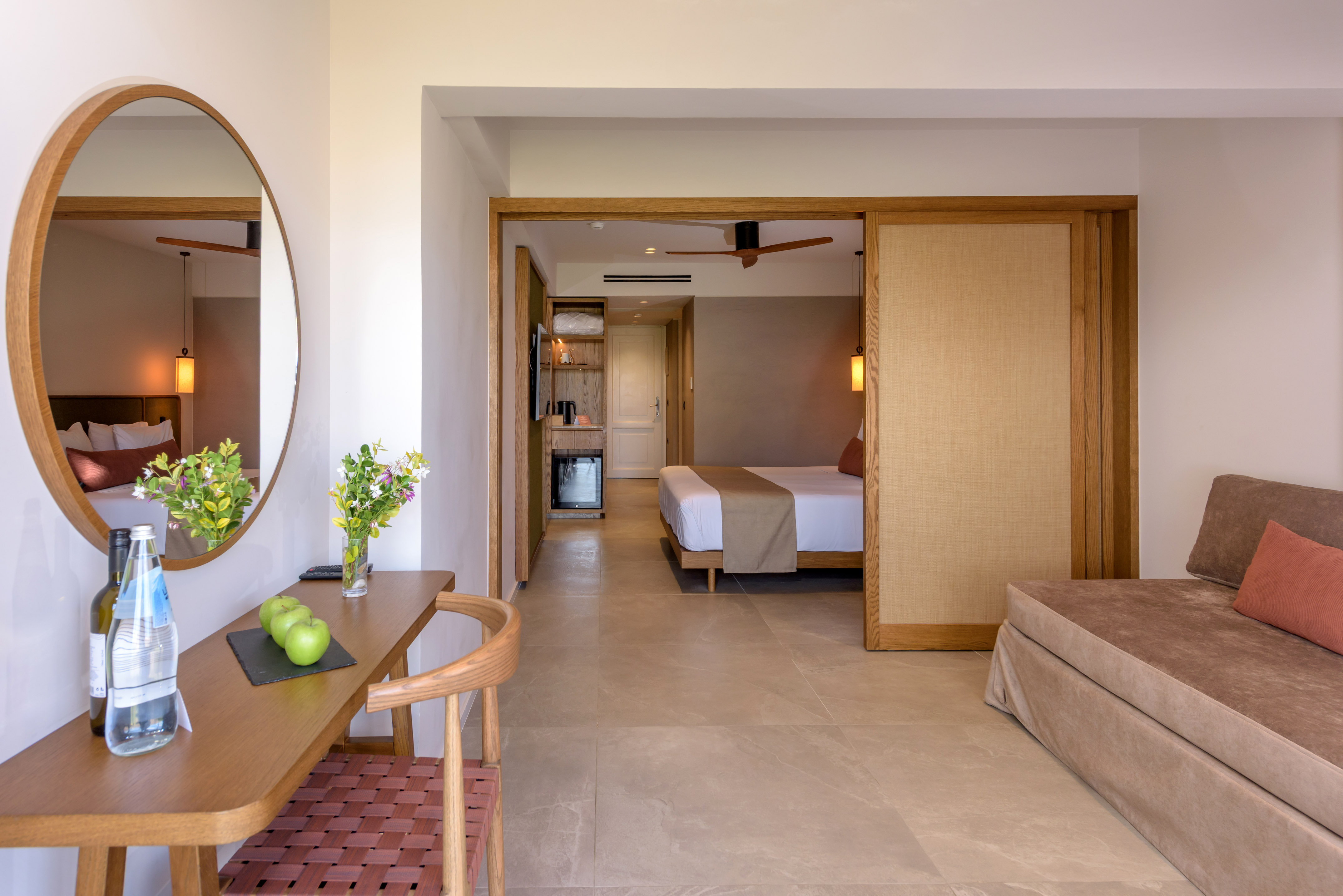 a room with a bed and a mirror