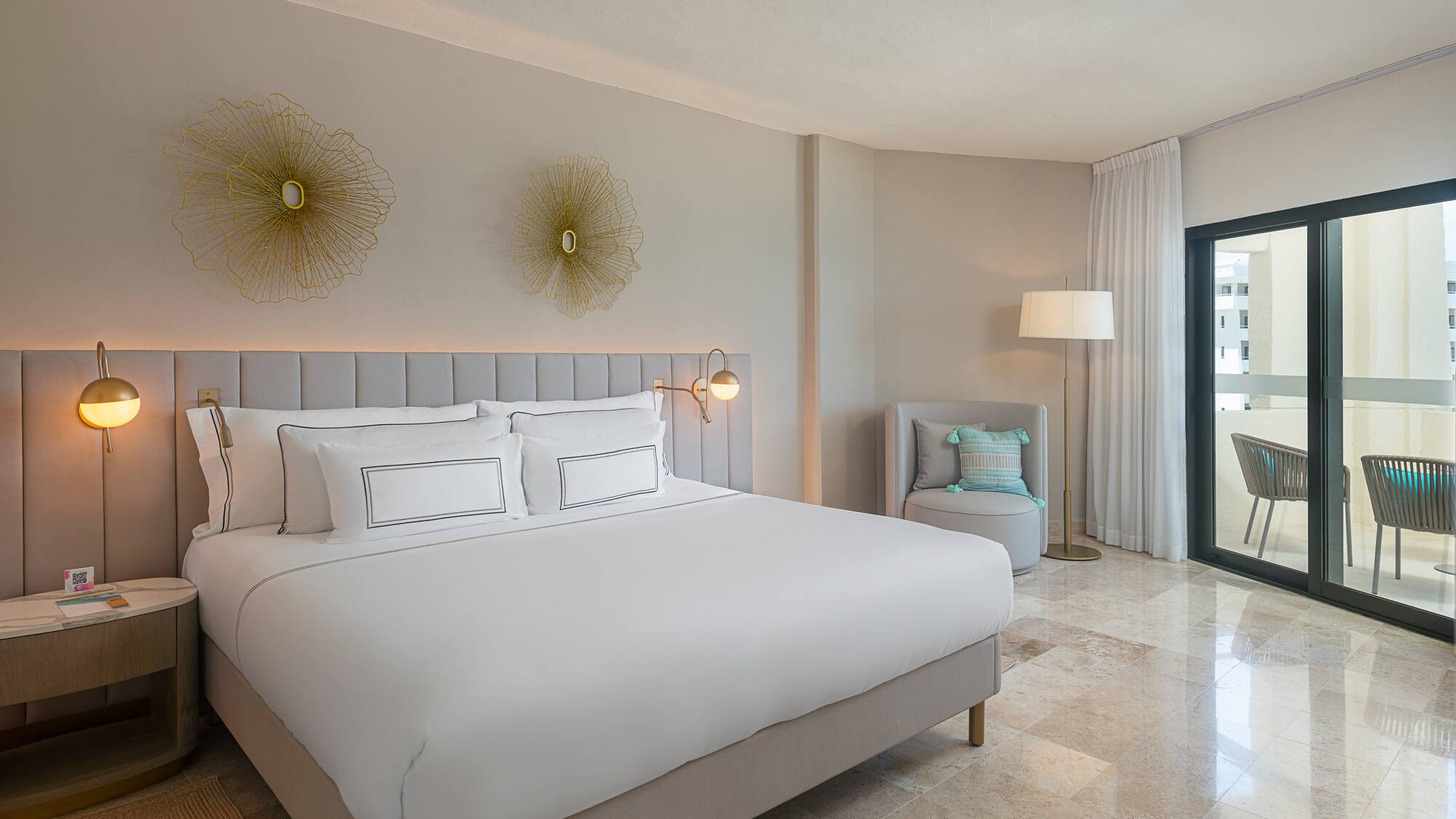 a bedroom with a bed and a chair