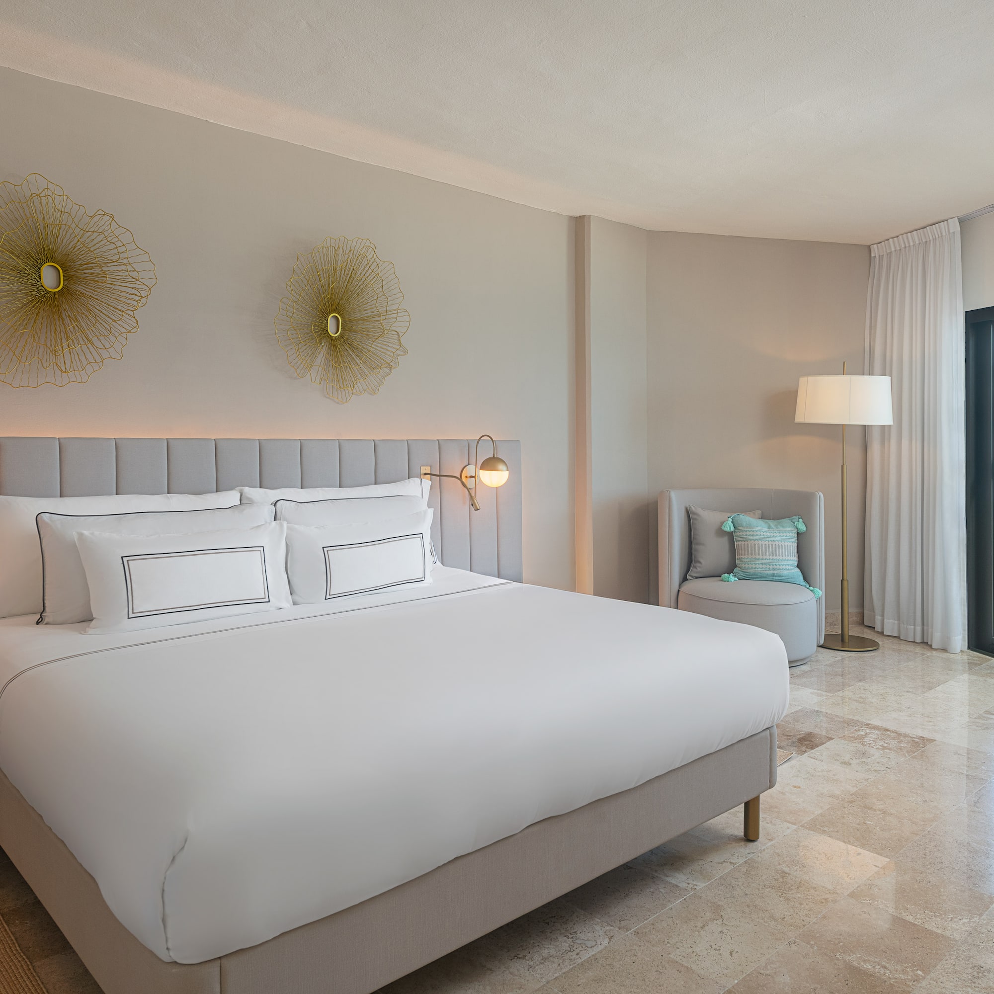 a bedroom with a bed and a chair