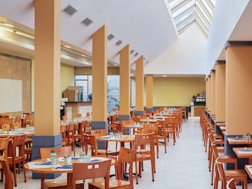 a room with tables and chairs