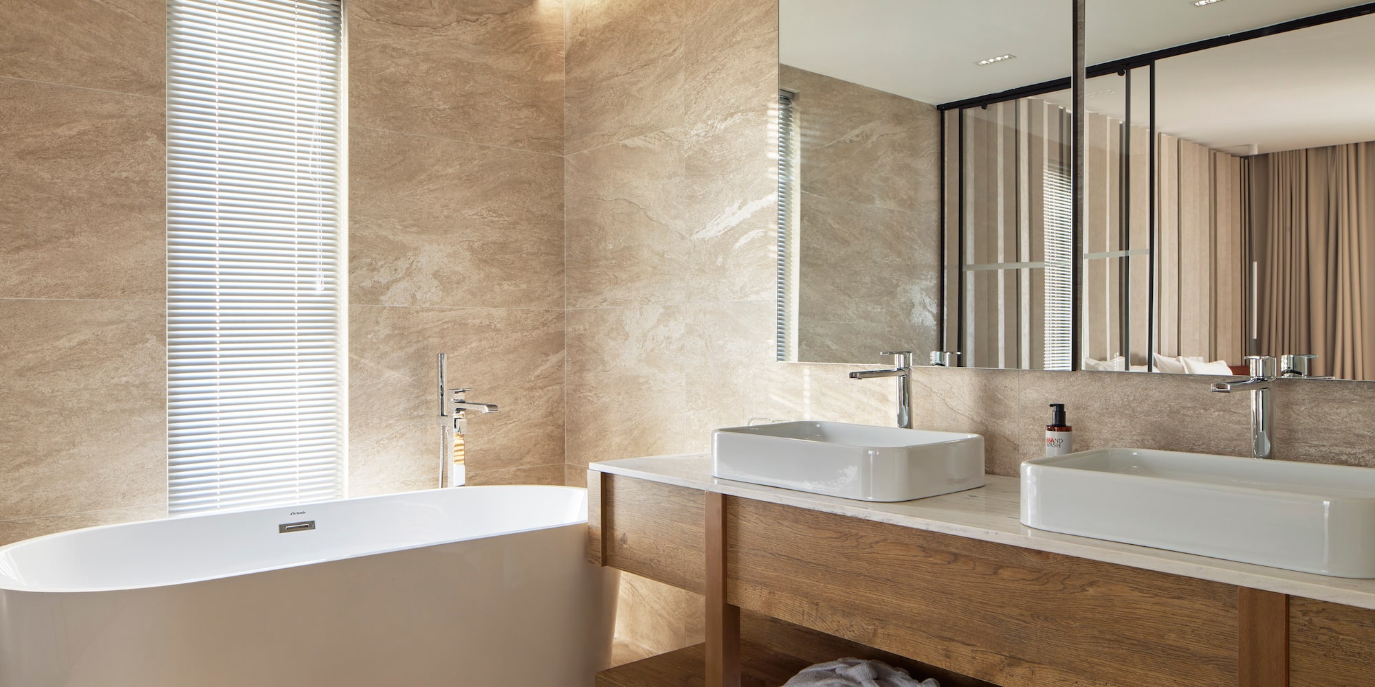 a bathroom with a tub and sink