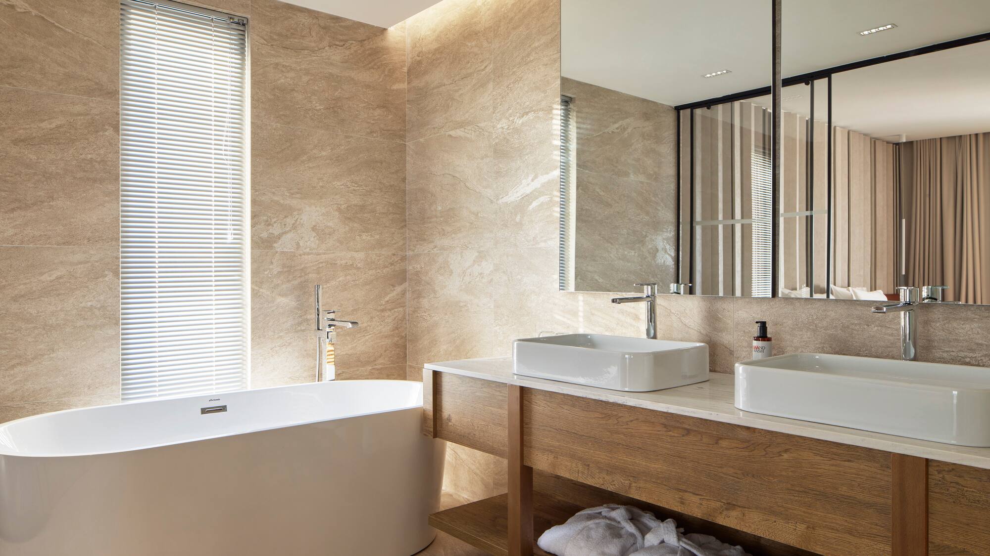 a bathroom with a tub and sink