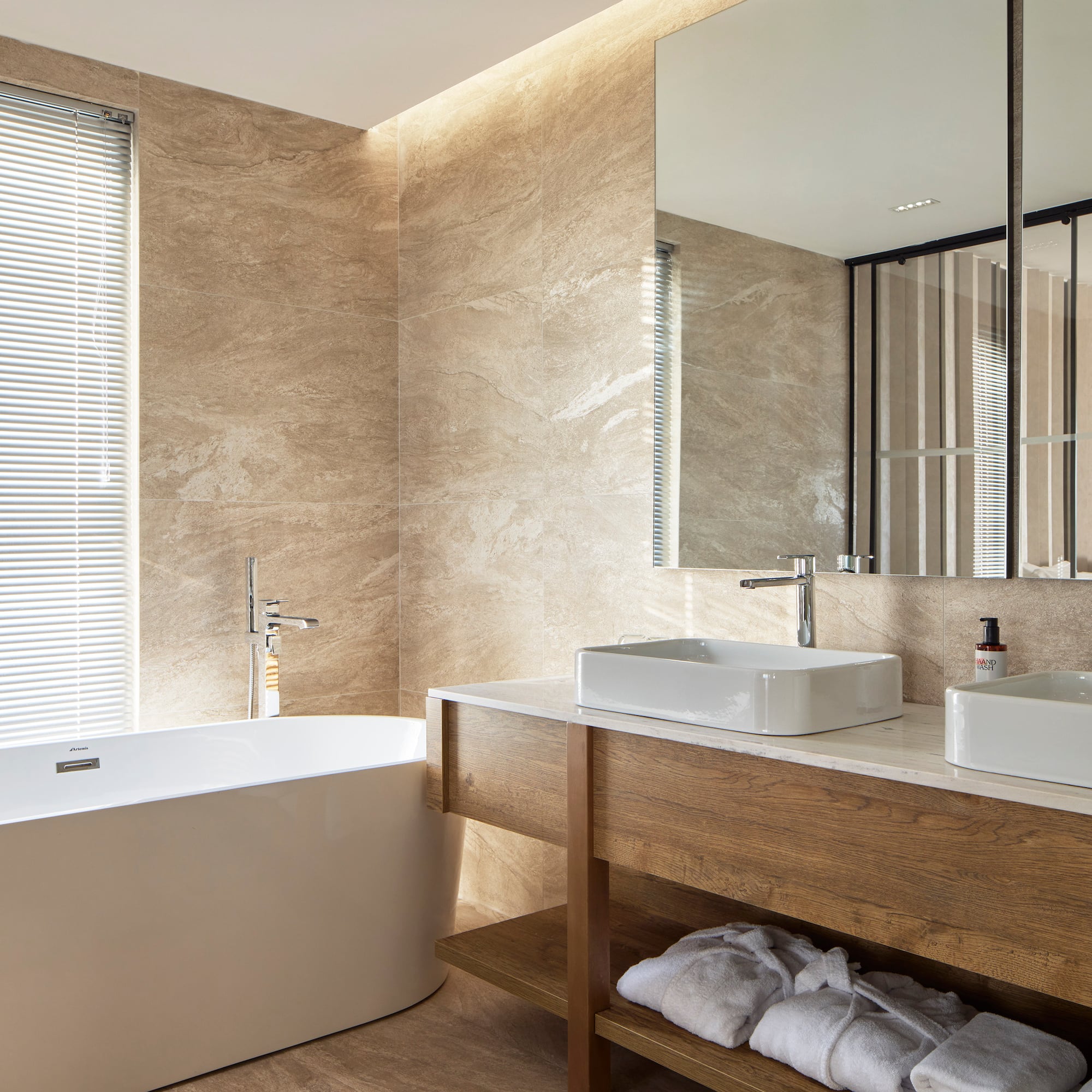 a bathroom with a tub and sink