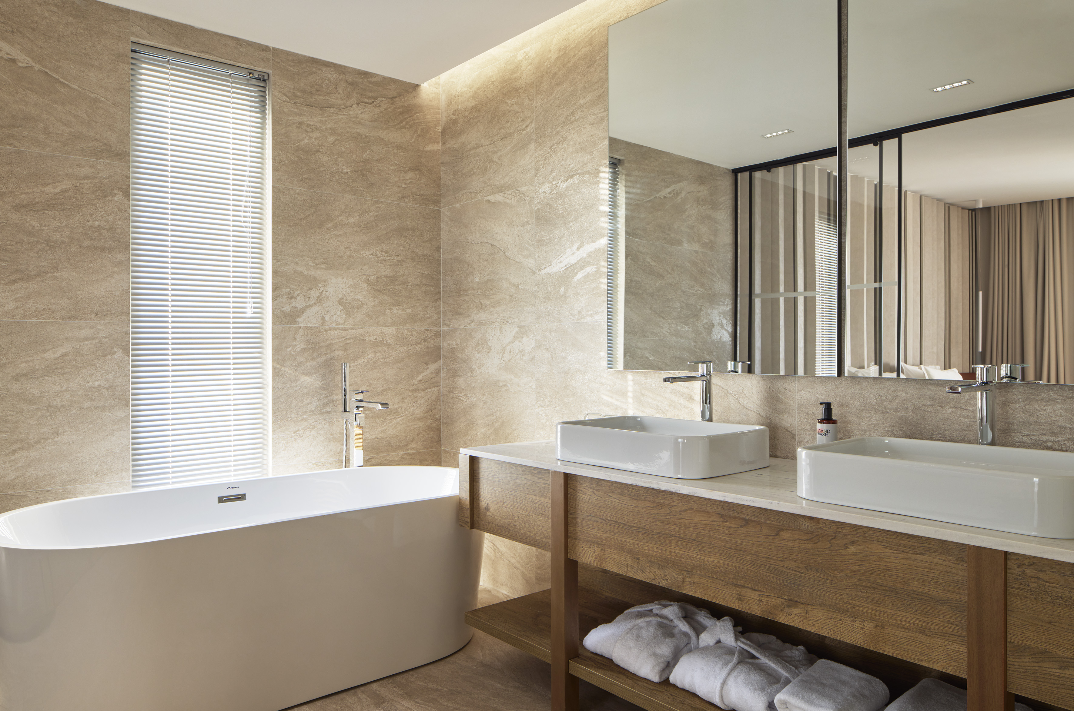 a bathroom with a tub and sink
