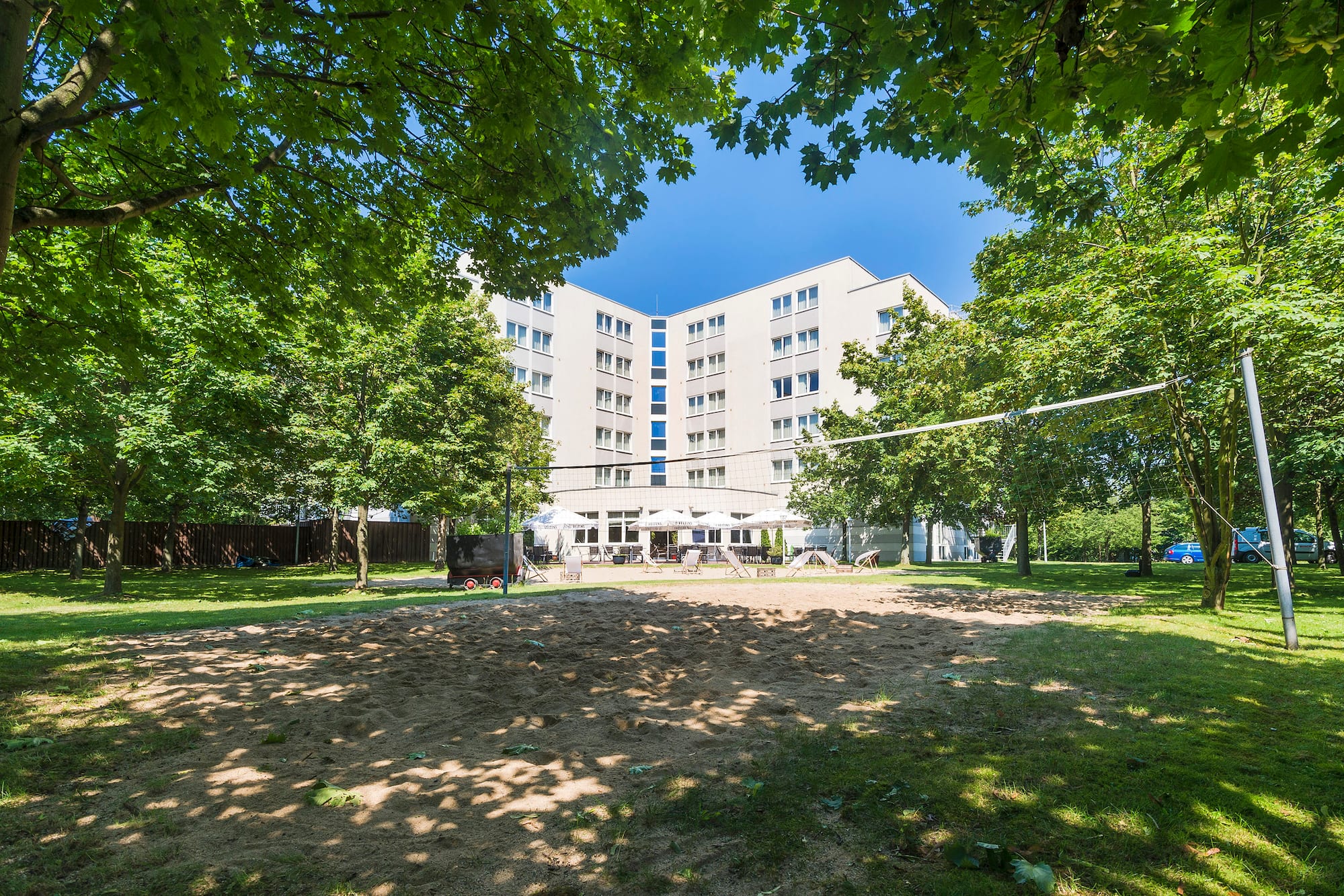 a volleyball court in front of a building