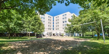 a volleyball court in front of a building