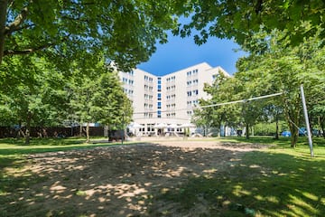 a volleyball court in front of a building