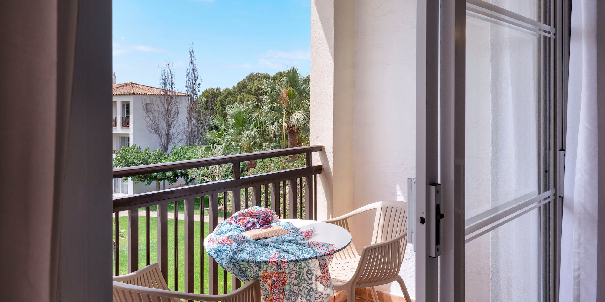 a patio with chairs and table