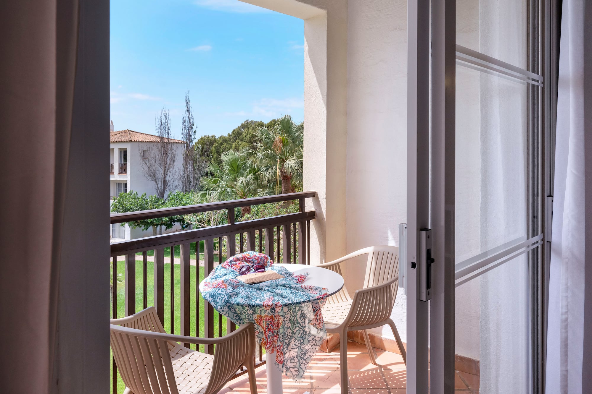 a patio with chairs and table