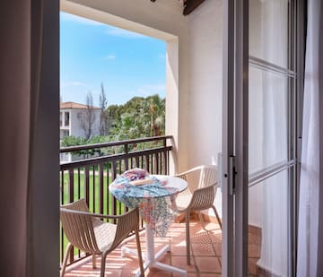 a patio with chairs and table
