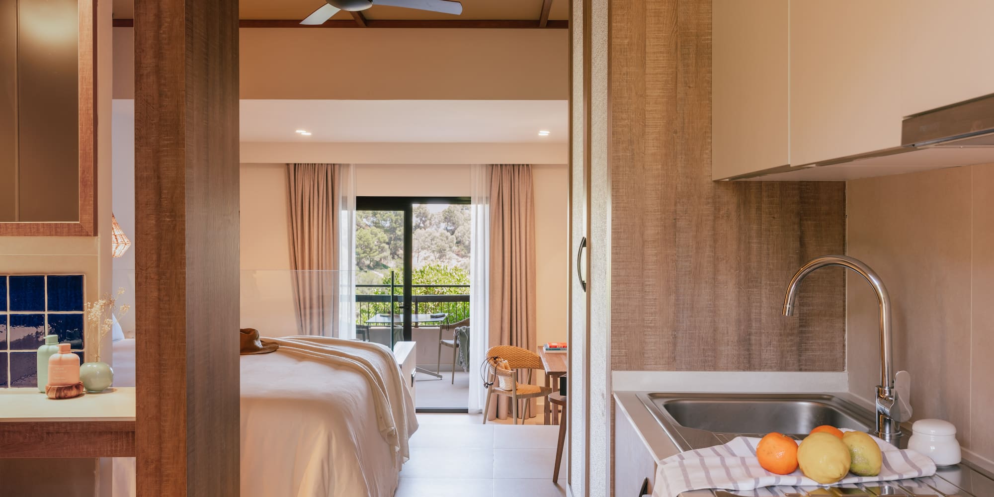 a room with a bed and sink and a window