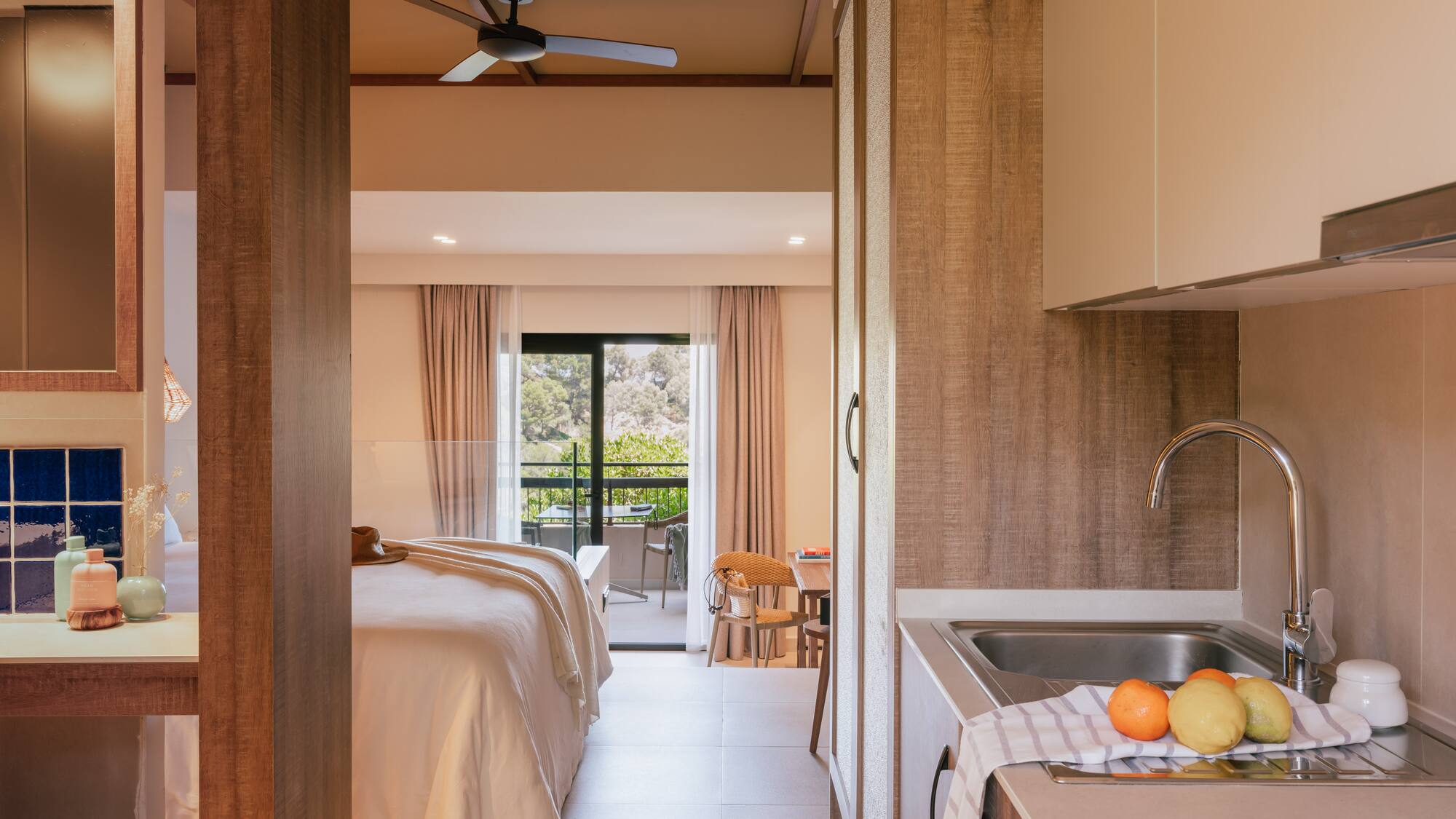 a room with a bed and sink and a window