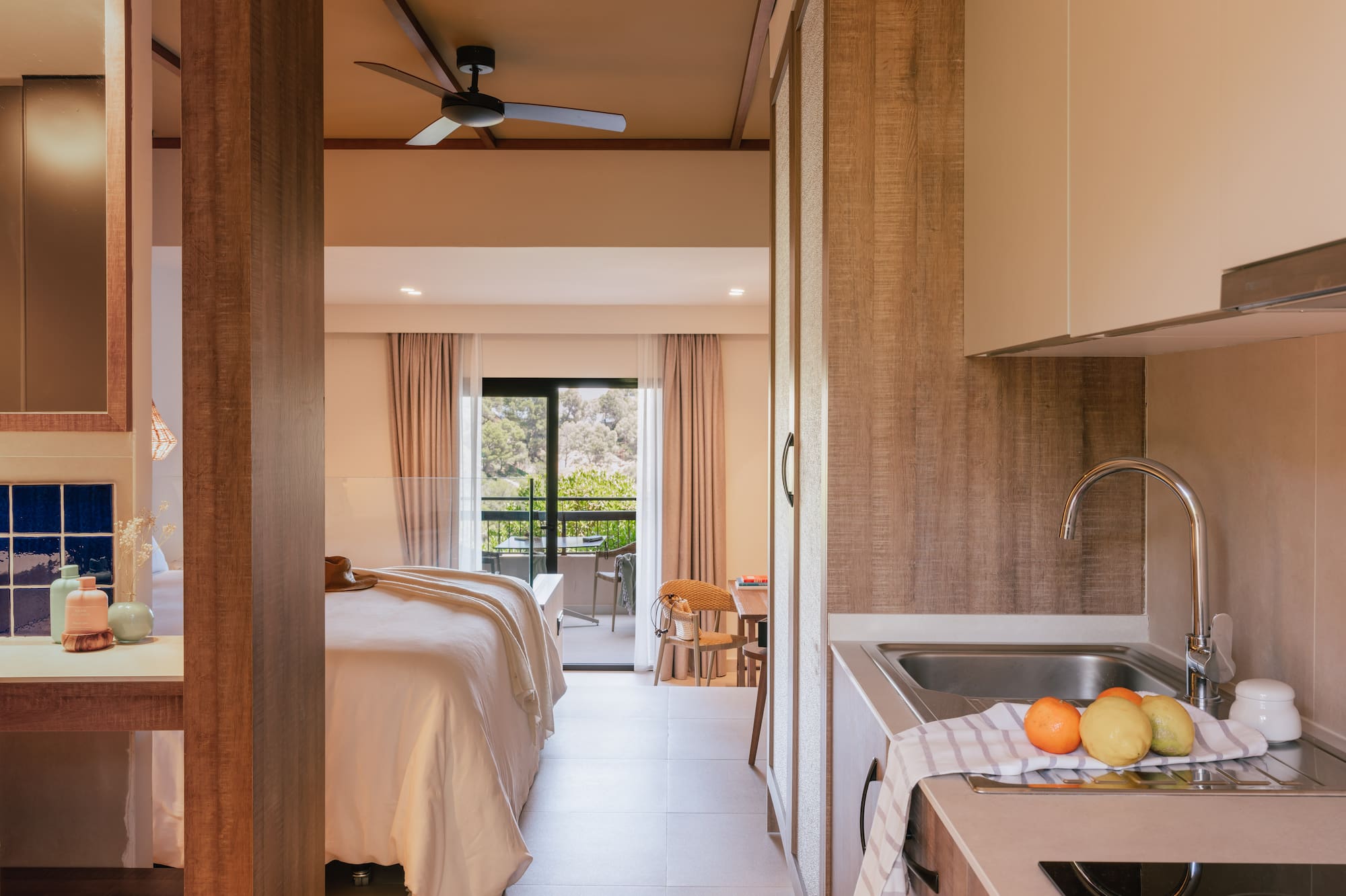 a room with a bed and sink and a window