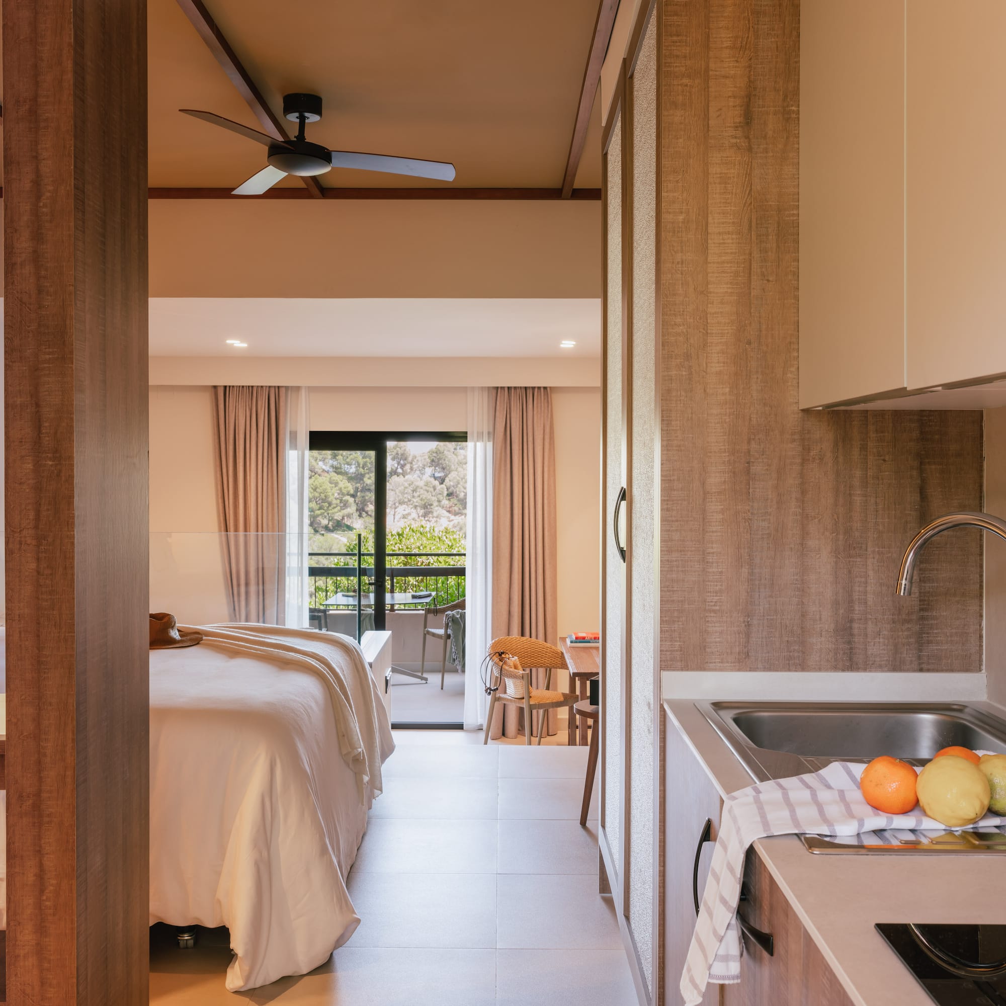 a room with a bed and sink and a window