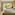 Modern hotel bedroom with king bed, lush tropical view, and decorative wood wall.