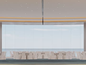 a room with white chairs and tables