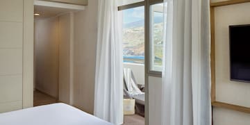 a room with a bed and a window
