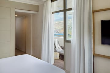 a room with a bed and a window