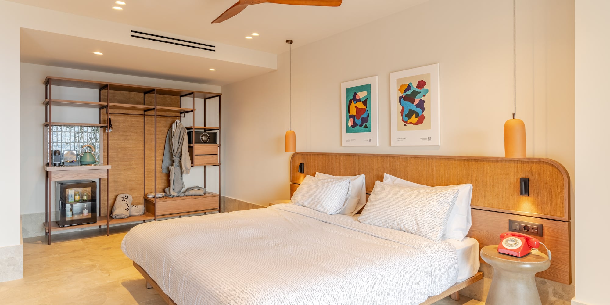 a room with a bed and a ceiling fan