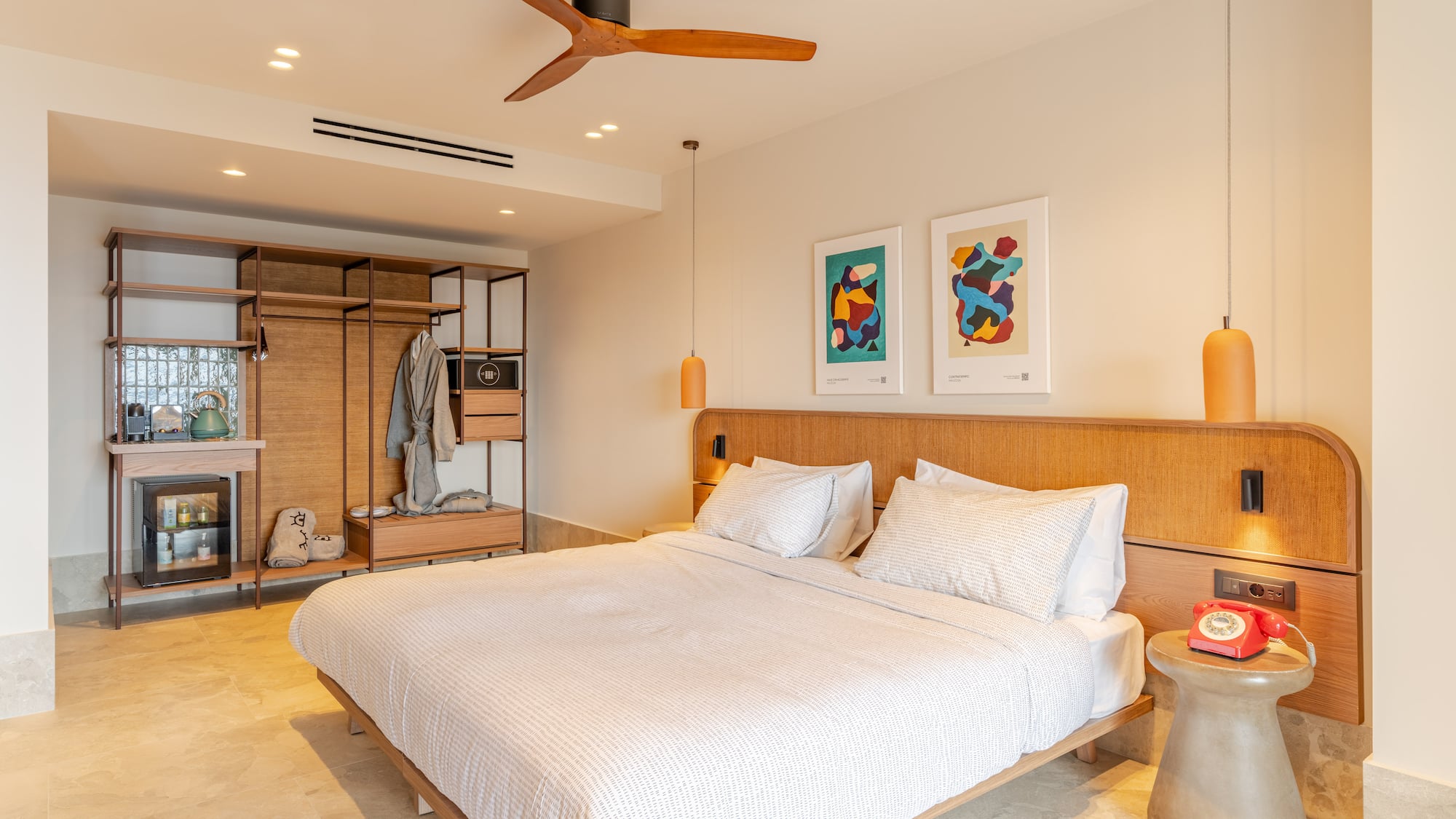 a room with a bed and a ceiling fan