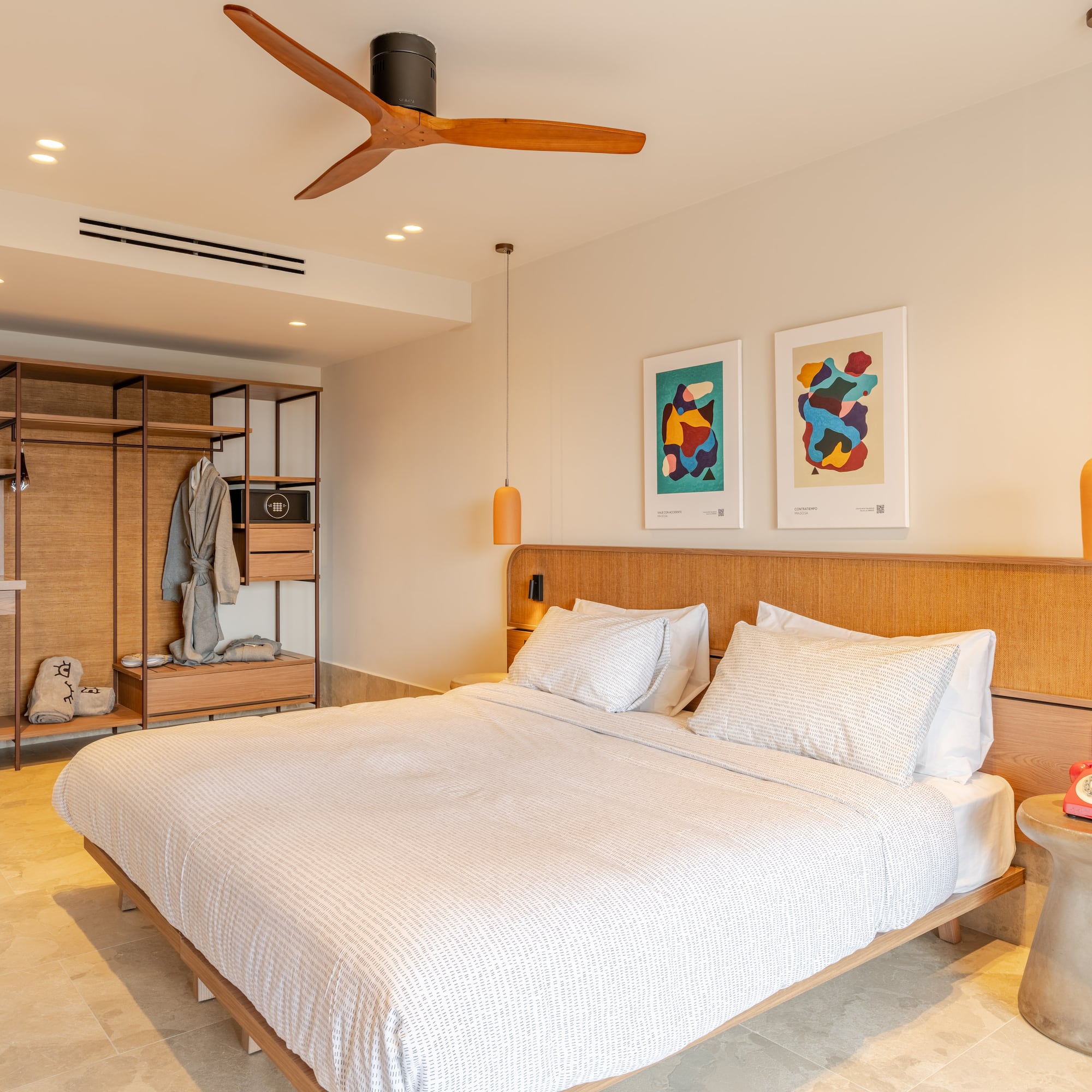 a room with a bed and a ceiling fan