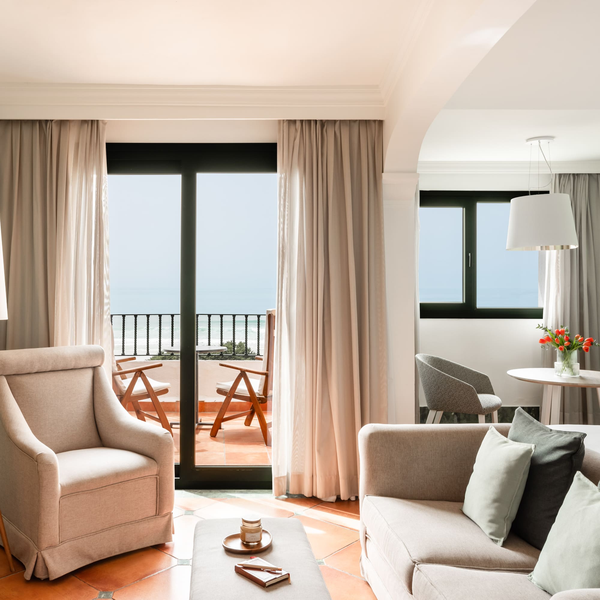 a living room with a couch and chairs