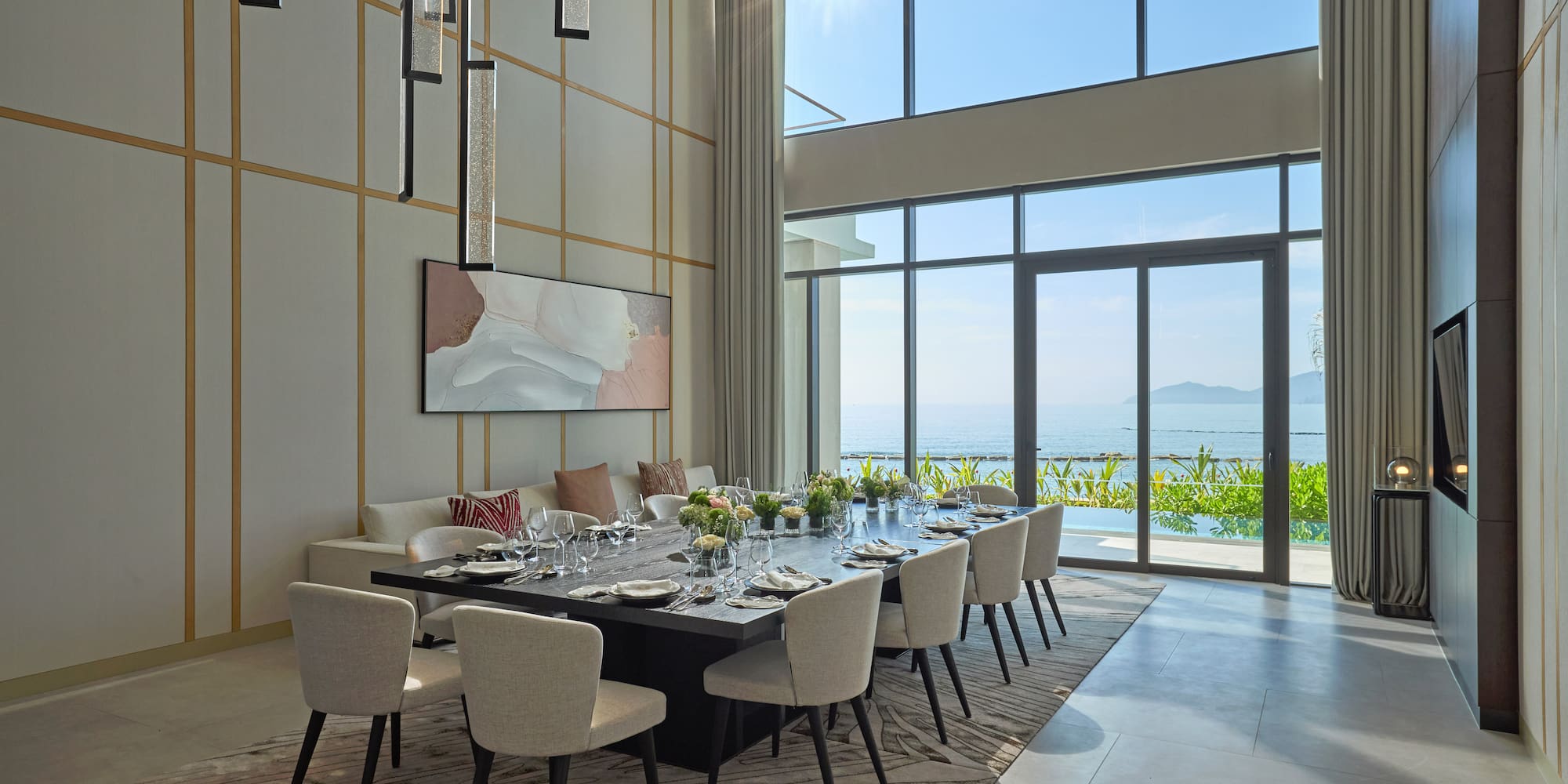 a dining room with a large table and chairs